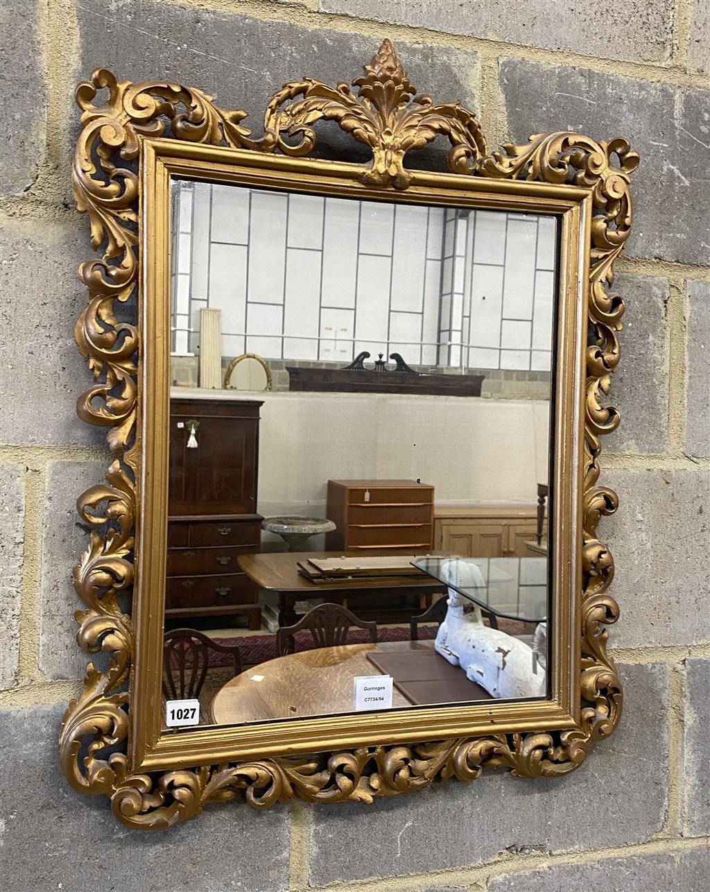 A Florentine style gilt carved wood wall mirror, width 58cm, height 76cm